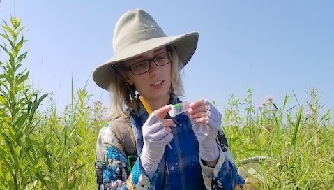 A picture of Alma Schrage in a field