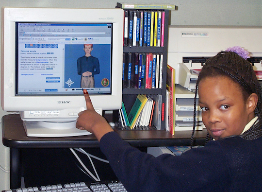 Photograph of a girl using a Signing Science dictionary